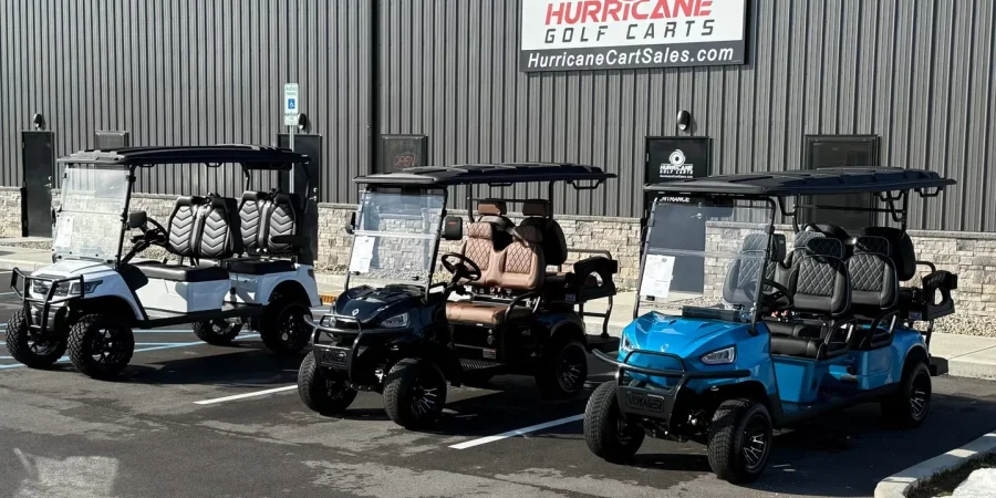 Three Hurricane Golf Carts displayed outside the Hurricane Golf Carts dealership
