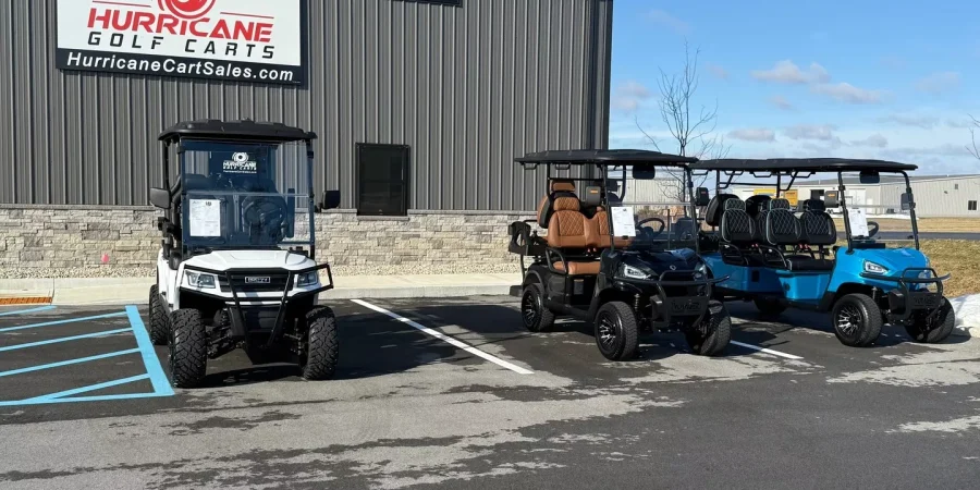 Three Hurricane Golf Carts displayed outside the Hurricane Golf Carts dealership